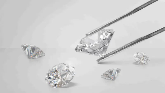 Selection of polished lab grown diamonds, including one held in precision tweezers, highlighting their ethical sourcing.